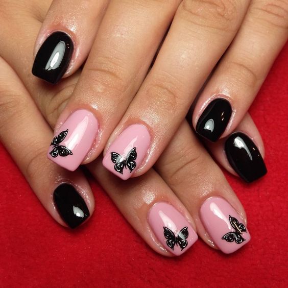 black and pink butterfly nails design