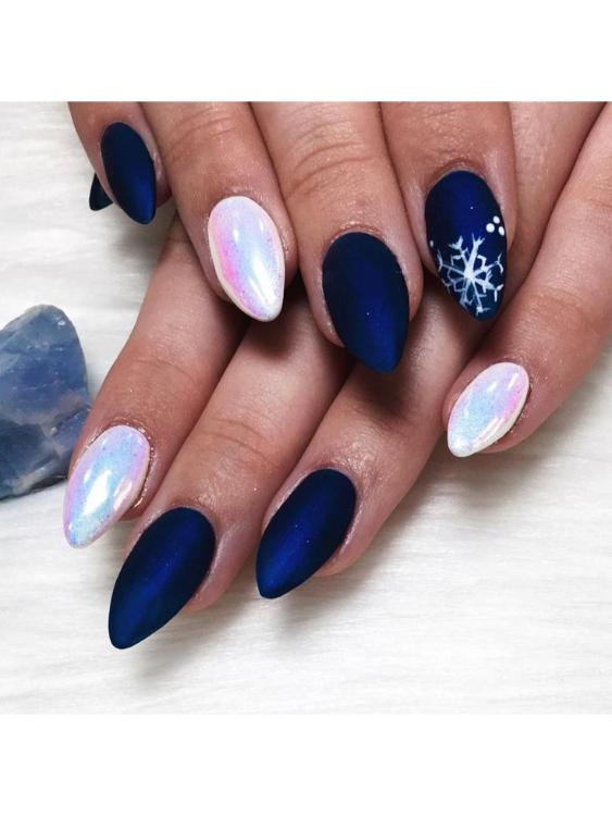 Stunning snowflake nail design on dream blue
