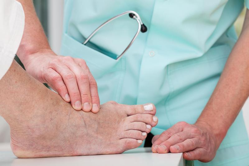 A-doctor-massaging-a-patients Podiatrist