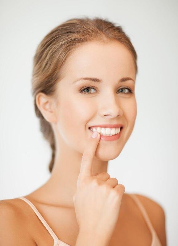 face-of-beautiful-woman-showin Perfect Smile for Your Face Shape