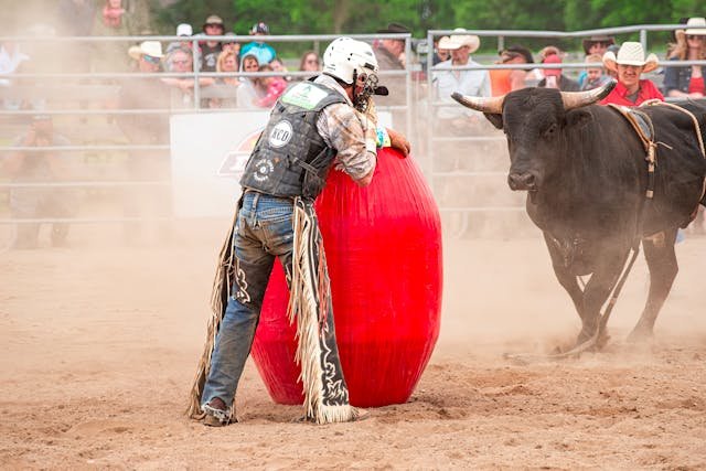 Bullfight in Pamplona with matador and charging bull.