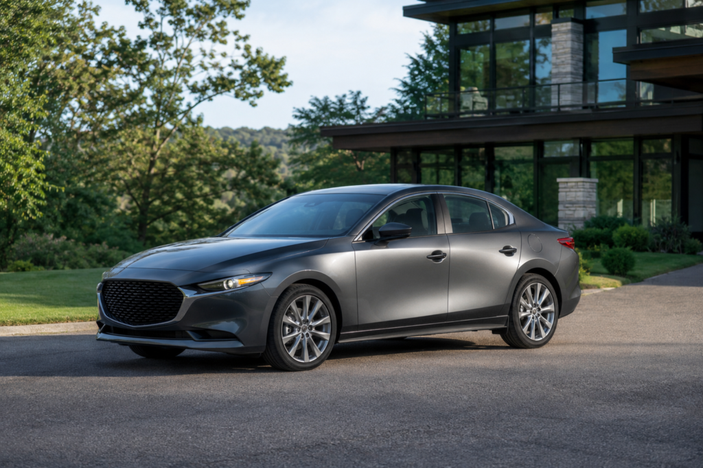 How to Choose the Right Midsize Sedan: Key Features to Consider Person comparing a modern midsize sedan with key features like safety, comfort, fuel efficiency, and technology.