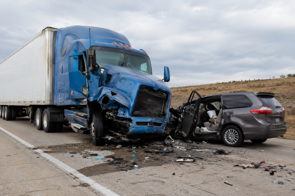 What Are the Leading Causes of Truck Accidents in Kansas? Semi-truck accident on a Kansas highway showing the leading causes of truck accidents in Kansas.