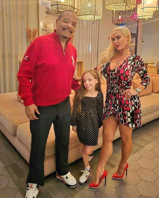 Ice-T, Coco Austin, and their daughter posing together as a family