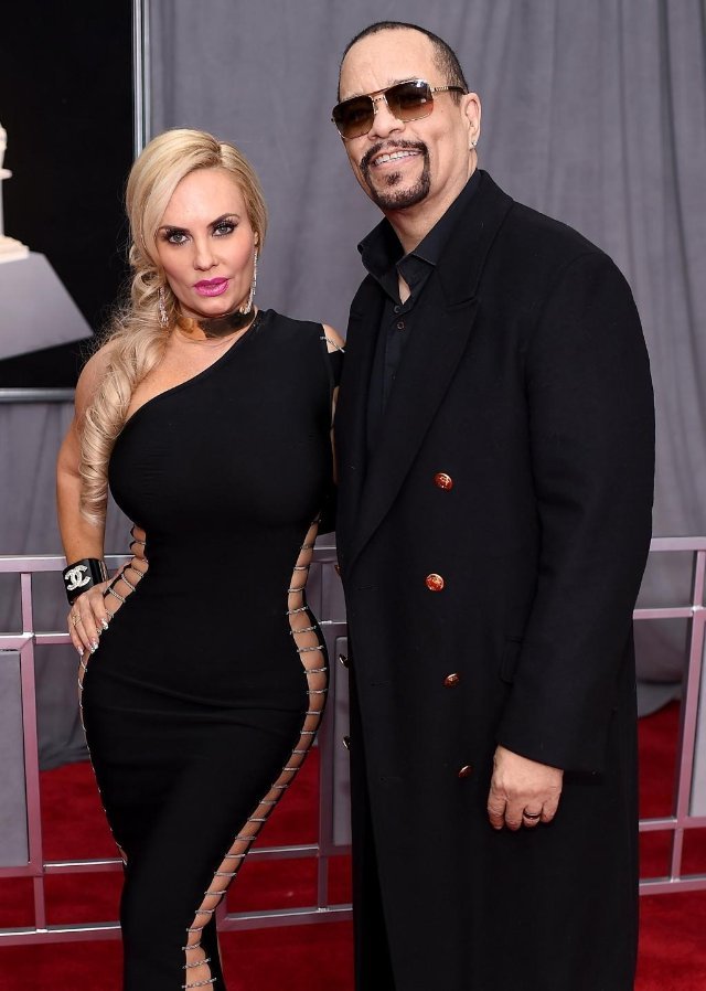 Ice-T and Coco Austin smiling together at a red carpet event
